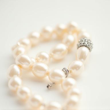 Classic pearl necklace with a diamond clasp.